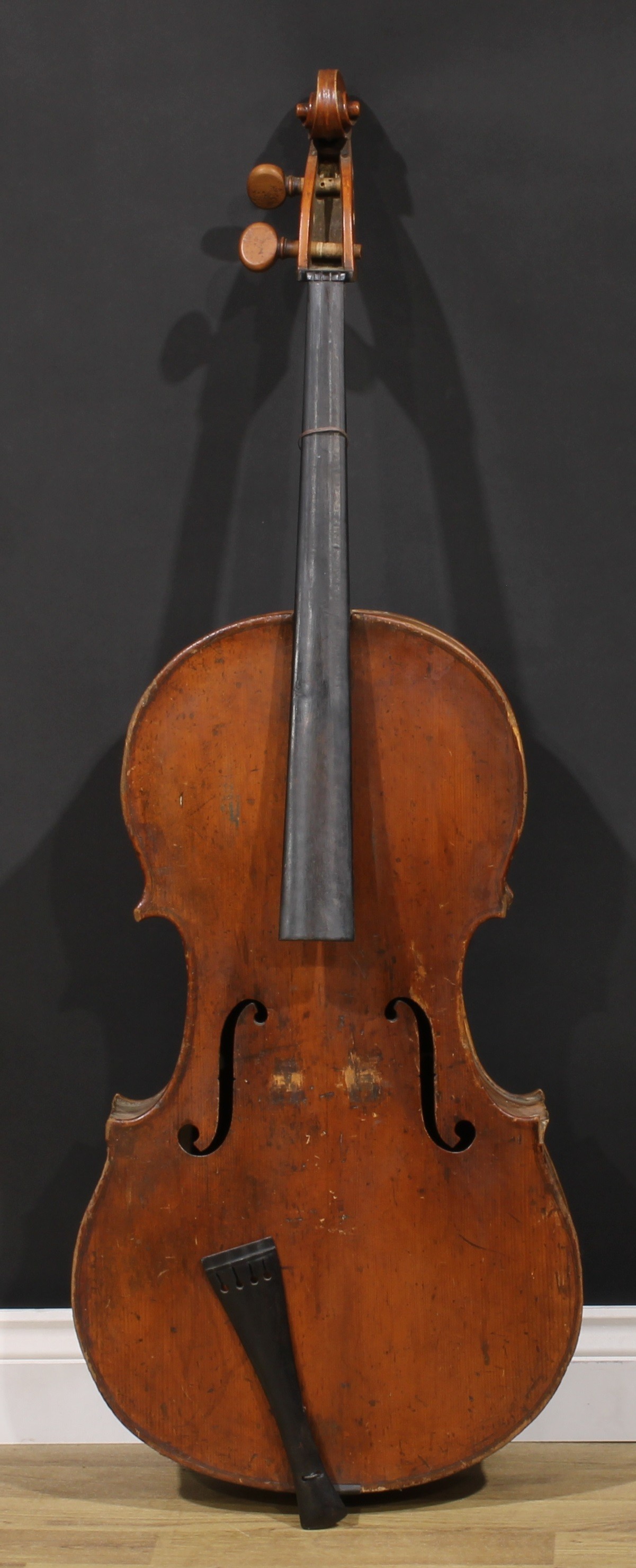 A cello, the two-piece back 74cm excluding button, boxwood tuning pegs, outlined throughout  with purfling, 120cm long overall