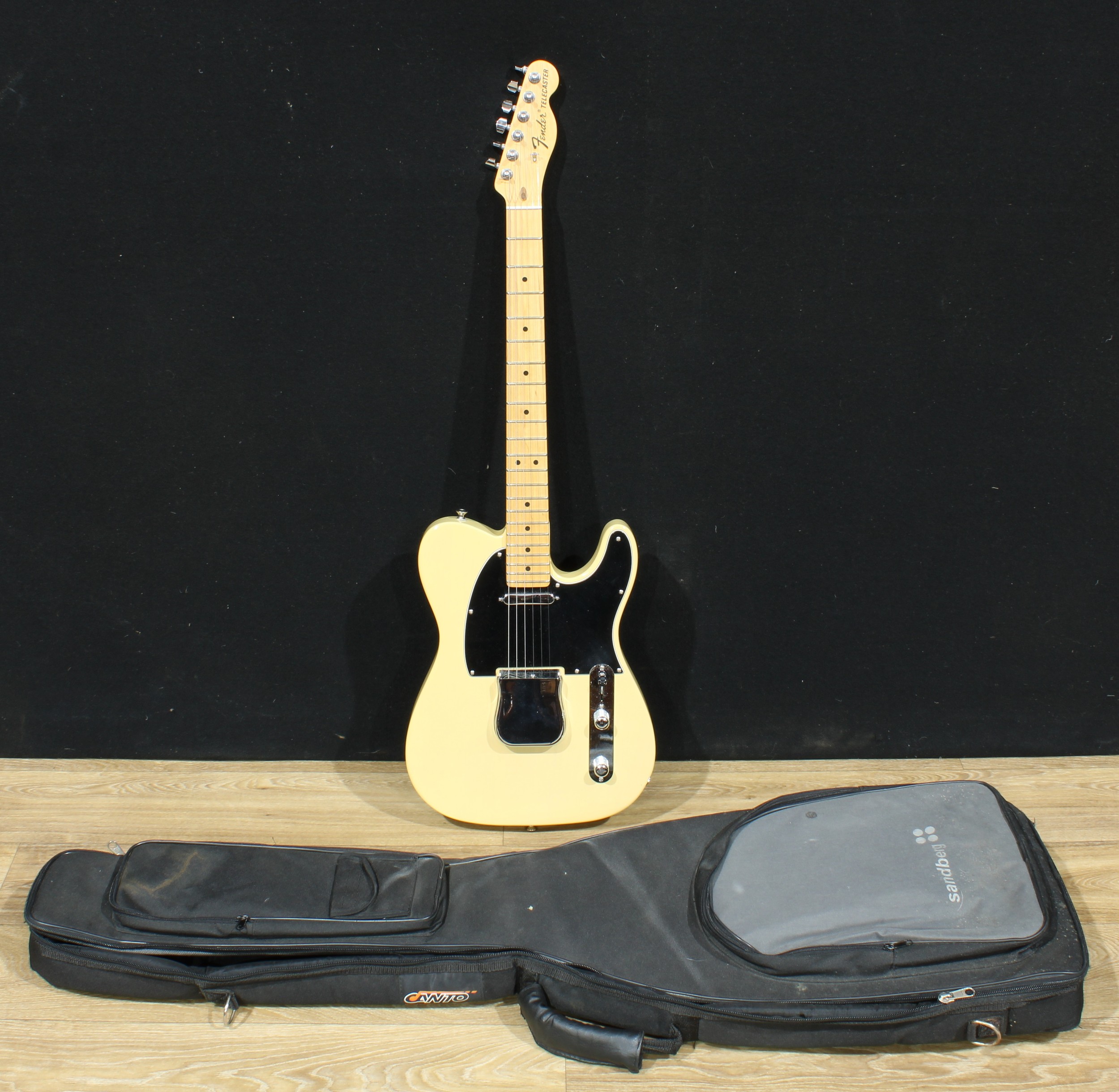 A Fender Telecaster guitar, made in the USA, numbered US15013243, ivorine-coloured finish, 98cm long, cased